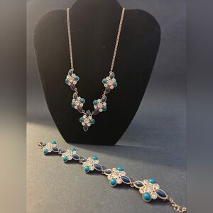 Vintage Avon necklace and bracelet set featuring blue and turquoise faux gemston